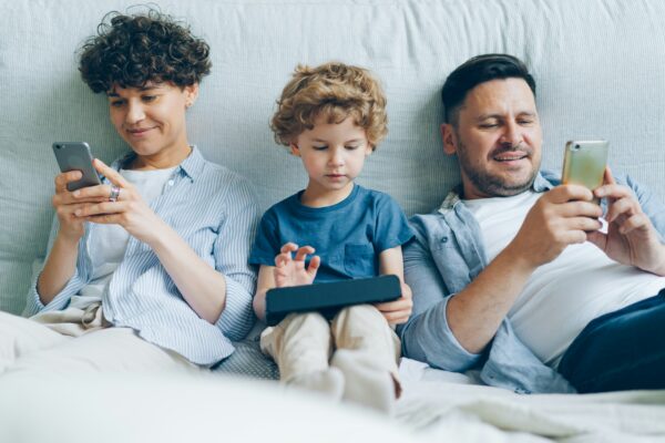 Family using IoT devices over a network